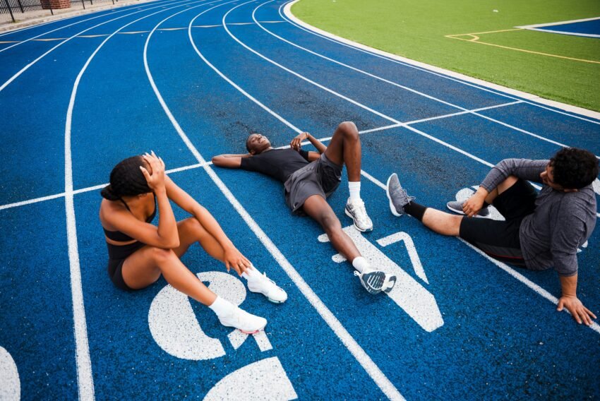 Athletes on running track after training session